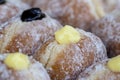 Donuts at street food market in Thailand, closeup. Tasty doughnuts with jam, chocolate and condensed milk Royalty Free Stock Photo