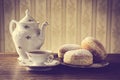 Donuts on tray with cup of coffee in old-fashioned