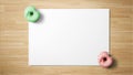 Donuts on white paper on wooden background