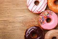 Donuts on wooden background Royalty Free Stock Photo