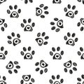 Doodle black paw prints with black hearts seamless fabric design repeated pattern Royalty Free Stock Photo