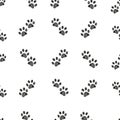 Doodle brown paw prints with pink hearts seamless vector pattern for fabric design Royalty Free Stock Photo