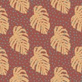 Doodle floral seamless pattern with hand drawn orange monstera ornament. Maroon background with dots