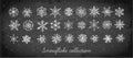 Doodle snowflakes hand drawn with white chalks on blackboard background.