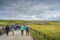 Crowd of tourists visiting iconic Cliffs of Moher, main visitor centre, Ireland
