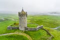 Doonagore Castle, round 16th-century tower house with a small walled enclosure located near the coastal village of Doolin in Royalty Free Stock Photo