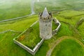 Doonagore Castle, round 16th-century tower house with a small walled enclosure located near the coastal village of Doolin in Royalty Free Stock Photo