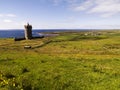 Doonagore Castle with a view of Doolin coastline Royalty Free Stock Photo