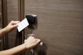 Door access control with a hand inserting key card to unlock door Royalty Free Stock Photo