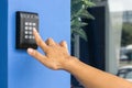 Door access control - young woman holding a key card to lock and unlock door., Keycard touch the security system to access the doo