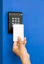 Young woman holding a key card to lock and unlock door., Royalty Free Stock Photo