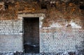 Door aperture inside the old ruined brick building Royalty Free Stock Photo