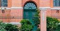 Door with arch in old brick building of Victorian era Royalty Free Stock Photo