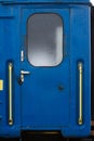 Door of a blue passenger car of a train Royalty Free Stock Photo