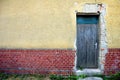 Door in brick and plaster wall