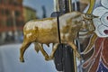Door bronze handle in the style of a bull. Glass door