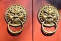 Door buckle of red wood door Royalty Free Stock Photo