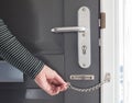 Door chain on a grey door