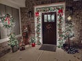 Door Christmas front door wreath Christmas tree garland brick entryway Christmas lights