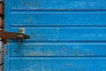 the door is closed with a nail, the background is blue wooden Royalty Free Stock Photo