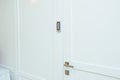 Door with coded lock in the middle of the room in white Royalty Free Stock Photo