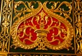 The door is decorated with a gilded painting in the form of a heart with beautiful monograms and leaves. Restoration Royalty Free Stock Photo