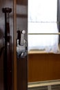 Door and doorknob in a train compartment. Travel by train. Royalty Free Stock Photo