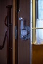 Door and doorknob in a train compartment. Travel by train. Royalty Free Stock Photo