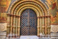 The door at the entrance to the assumption Cathedral of the Kremlin. Ancient gate painted with icons with the faces of saints - Royalty Free Stock Photo