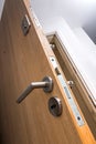 Armored door clad in wood of a family home. Close-up of the lock. Royalty Free Stock Photo