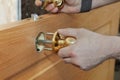 Door Furniture, woodworker installing locked interior turning d Royalty Free Stock Photo