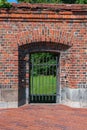 Door grating in an old brick wall Royalty Free Stock Photo