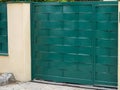 Door green wooden gate high in street view outdoor home portal entrance Royalty Free Stock Photo