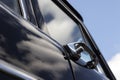 Door handle of a black retro car. Royalty Free Stock Photo