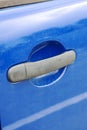Door handle on a blue car closeup Royalty Free Stock Photo