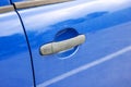 Door handle on a blue car closeup Royalty Free Stock Photo