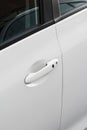 Door handle close-up of a white modern car Royalty Free Stock Photo