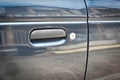 door handle of dark blue old car, dirty door handle and scratch of old car Royalty Free Stock Photo