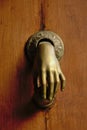 Door handle with iron sculpture of a hand