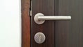 Door handle and keyhole on wooden door Royalty Free Stock Photo