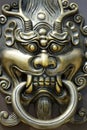 detail of door handle with lion design in buddhist temple Royalty Free Stock Photo