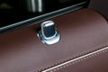 Door handle with lock control buttons of a luxury passenger car. Red leather interior of the luxury modern car. Modern car Royalty Free Stock Photo