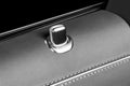 Door handle with lock control buttons of a luxury passenger car. Red leather interior of the luxury modern car. Modern car interio Royalty Free Stock Photo