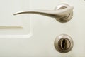 Door handle and lock with key Royalty Free Stock Photo