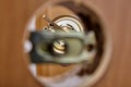 Door handle mechanism shutter is visible in hole of latch assembly