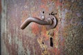 Door handle on an old metal door Royalty Free Stock Photo