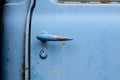 Door handle of an old truck in blue Royalty Free Stock Photo