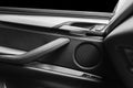 Door handle with Power window control buttons of a luxury passenger car. Black leather interior of the luxury modern car. Modern Royalty Free Stock Photo