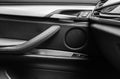 Door handle with Power window control buttons of a luxury passenger car. Black leather interior of the luxury modern car. Modern c Royalty Free Stock Photo