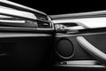 Door handle with Power window control buttons of a luxury passenger car. Black leather interior of the luxury modern car. Modern c Royalty Free Stock Photo